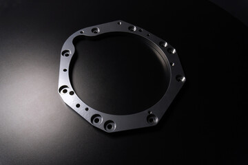 adapter plate for car tuning transmission replacement photographed at a long exposure