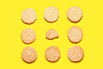 Delicious cookies with chocolate chips on yellow background