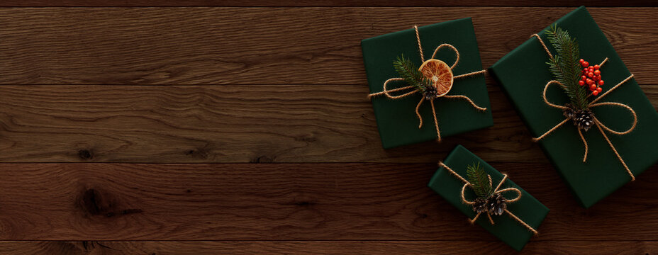 Christmas Presents wrapped in Green paper with Homemade decorations.