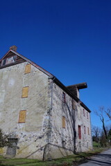 Abandoned Colonial Mill on Sunny Fall Day