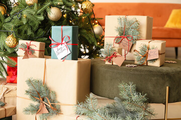 Fototapeta na wymiar Pouf with Christmas presents in living room