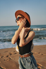 woman walking on the beach landscape sun fun lifestyle