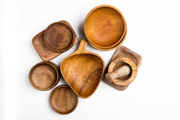 wooden tableware cups, bowls and stupa on white background