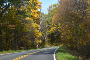 Winding Country Road Traveling Through Beautiful Fall Foliage