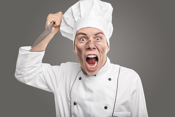 Screaming dirty chef threatening with knife
