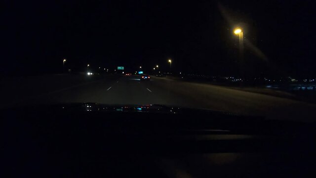 Timelapse of Driving at American Highway on Dark Night. Driver POV of Car Lights adn Traffic