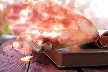 Blurred open old book with bokeh lights