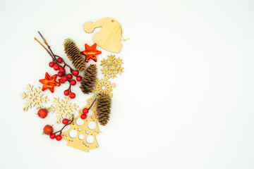christmas layout with wooden toys, snowflakes, christmas tree, santa claus hat, pine cone, candle, decoration, side