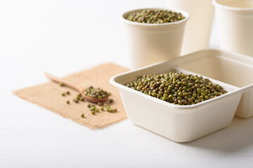 Mungbeans in compostable cardboard boxes are eco-friendly concepts and are mainly used as a plant-based ingredient in vegetarian, healthy food.