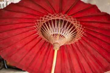 red traditional umbrella with bamboo 