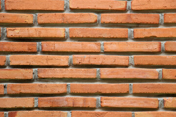 Obraz premium Old brick wall with orange color as the background.