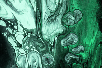 Abstract fluid art background black and dark green colors. Liquid acrylic painting with emerald gradient.