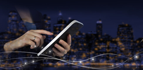Innovative, and global network connection, Data exchanges. Hand touch white tablet with digital hologram wave sign on city dark blurred background. Business network communication and innovation.