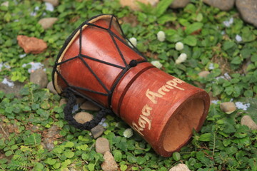 unique souvenirs of traditional percussion instruments called Kendang typical of Papua Indonesia,...