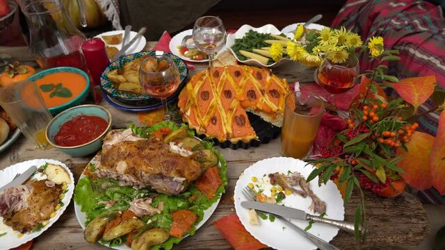 Thanksgiving Leftovers. Uneaten meals on the festive table. Family Dinner Loss. Food and drink waste. Throwing holiday leftovers in the trash