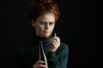 woman with bottle of alcohol bruises under eyes changes depression dark background