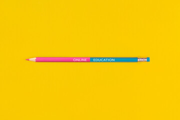 The text "Online education" on text on color pencil
