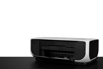 Laser home printer on table against white backgorund