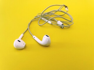 earbuds  on yellow background