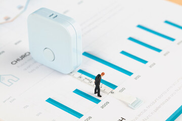 File histogram tape measuring growth and businessman