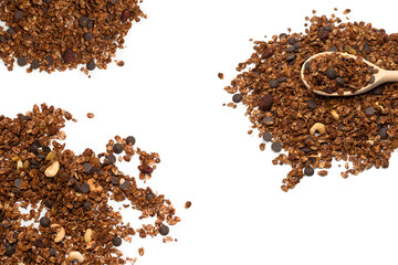 Chocolate granola cereal with nuts in a wooden spoon.