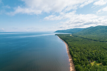 Summertime imagery of Lake Baikal is a rift lake located in southern Siberia, Russia Baikal lake summer landscape view from a cliff near Grandma's Bay. Drone's Eye View.