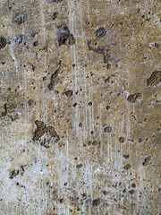 Textured concrete background with many potholes, scratches, irregularities, scuffs with colored...