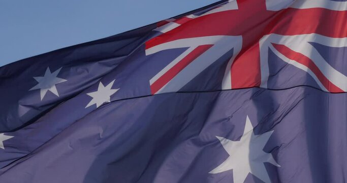 The national australian flag waving in the wind.