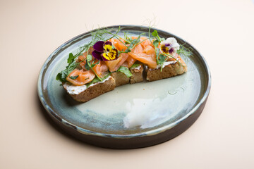 Sliced salmon with cream cheese on a toast