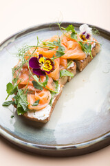 Sliced salmon with cream cheese on a toast
