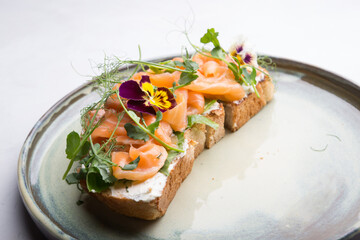 Sliced salmon with cream cheese on a toast