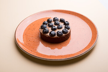 Whole round blueberry pie served for dessert