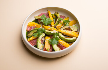 Grilled tuna salad with mango and avocado