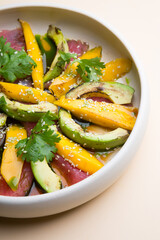 Grilled tuna salad with mango and avocado