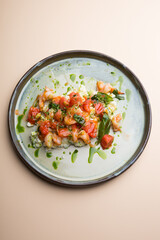 Egg and shrimp omelet served with tomatoes