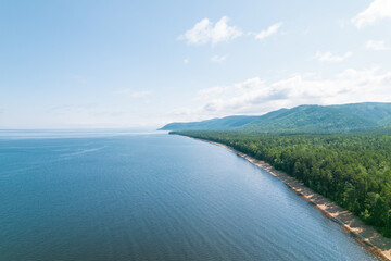 Summertime imagery of Lake Baikal is a rift lake located in southern Siberia, Russia Baikal lake summer landscape view from a cliff near Grandma's Bay. Drone's Eye View.