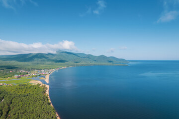 Summertime imagery of Lake Baikal is a rift lake located in southern Siberia, Russia Baikal lake summer landscape view from a cliff near Grandma's Bay. Drone's Eye View.