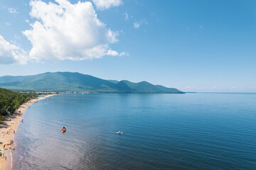 Summertime imagery of Lake Baikal is a rift lake located in southern Siberia, Russia Baikal lake summer landscape view from a cliff near Grandma's Bay. Drone's Eye View.