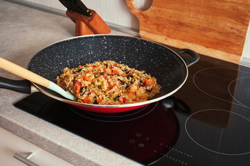 Tasty rice with vegetables prepared in wok