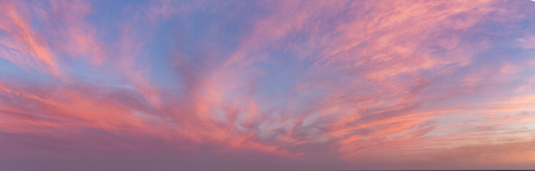 Panorama of Dramatic vibrant color with beautiful cloud of sunrise and sunset. Panoramic image.