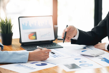 Business people hands working on business graph and chart at office.