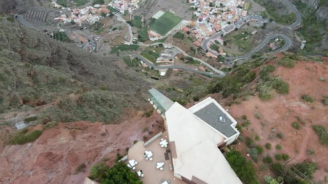 Aerial view of a restaurant on a clifftop mountain with amazing ocean views in Abrante, La Gomera