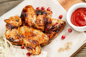 chicken wings grill. Serving on a white plate on a table. Barbecue restaurant menu, a series of photos of different meats