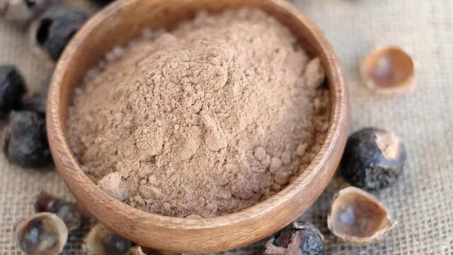 pile of ground soap nut powder for ecological washing. The raw fruit arita or rita, also known as soap nuts, is the main ingredient in any soap and shampoo.