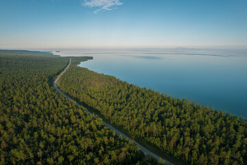 Fototapeta na wymiar Summertime imagery of Lake Baikal in morning is a rift lake located in southern Siberia, Russia. Baikal lake summer landscape view. Drone's Eye View.
