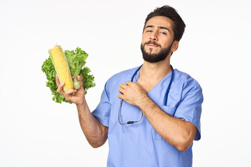 Cheerful dietitian with vegetables in hands vitamins healthy food