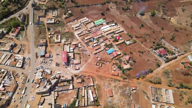Jib down of slums at the edge of small African town in rural Kenya