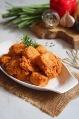 a plate of crispy fried tofu
