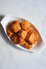 a plate of crispy fried tofu
