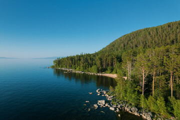 Summertime imagery of Lake Baikal is a rift lake located in southern Siberia, Russia Baikal lake summer landscape view from a cliff near Grandma's Bay. Drone's Eye View.